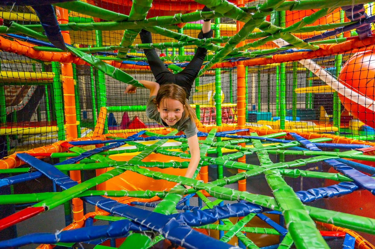 Happy child in a jungle gym